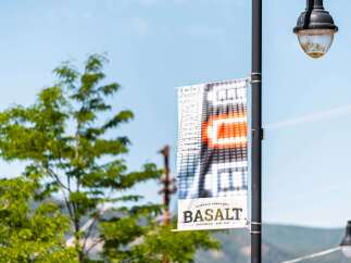 Discover the charm of Basalt, Colorado! This image showcases a banner for the historic downtown, a vibrant area with unique shops and dining.