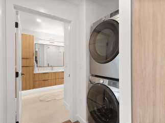 Step into modern luxury with this stunning property, featuring a beautifully designed laundry area.