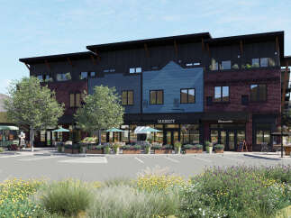 This stunning commercial property boasts a modern design with a mix of brick and wood siding, creating a unique and inviting facade.