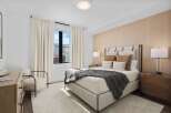 Experience luxury in this stunning bedroom, featuring a plush bed and elegant decor.