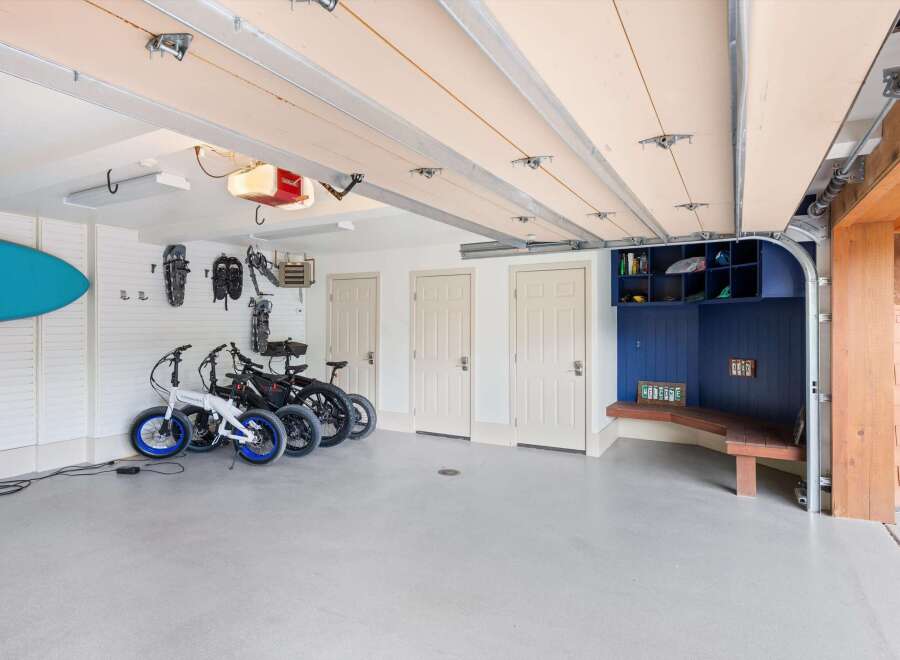 This spacious garage offers ample storage and organization solutions, perfect for outdoor enthusiasts.