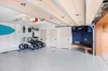 This spacious garage offers ample storage and organization solutions, perfect for outdoor enthusiasts.