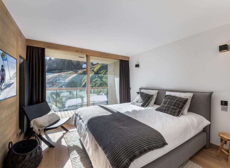Experience luxury living in this stunning bedroom with breathtaking views.