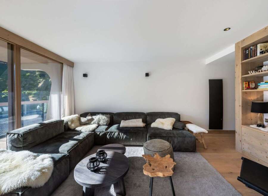 This stunning living room boasts a modern design with a cozy atmosphere.