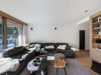 This stunning living room boasts a modern design with a cozy atmosphere.
