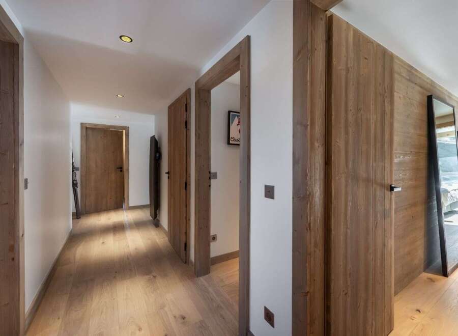 Step into a world of rustic elegance with this stunning hallway.