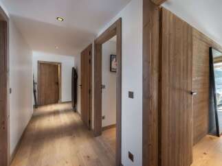 Step into a world of rustic elegance with this stunning hallway.