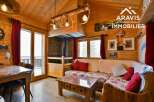 Discover the charm of this cozy chalet, featuring a warm wooden interior and a welcoming living space.