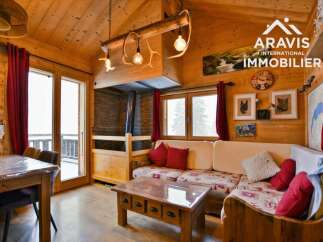 Discover the charm of this cozy chalet, featuring a warm wooden interior and a welcoming living space.