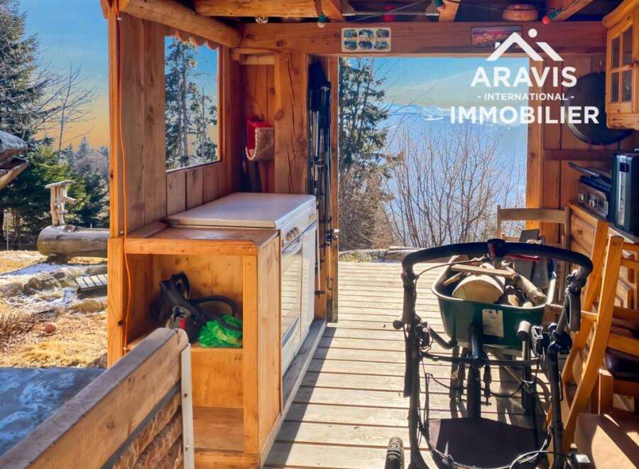 Discover the charm of this unique property, featuring a rustic wooden structure perfect for a cozy retreat.