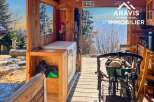 Discover the charm of this unique property, featuring a rustic wooden structure perfect for a cozy retreat.