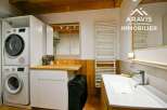 Discover this charming property featuring a modern laundry area with stacked washer and dryer, perfect for efficient living.