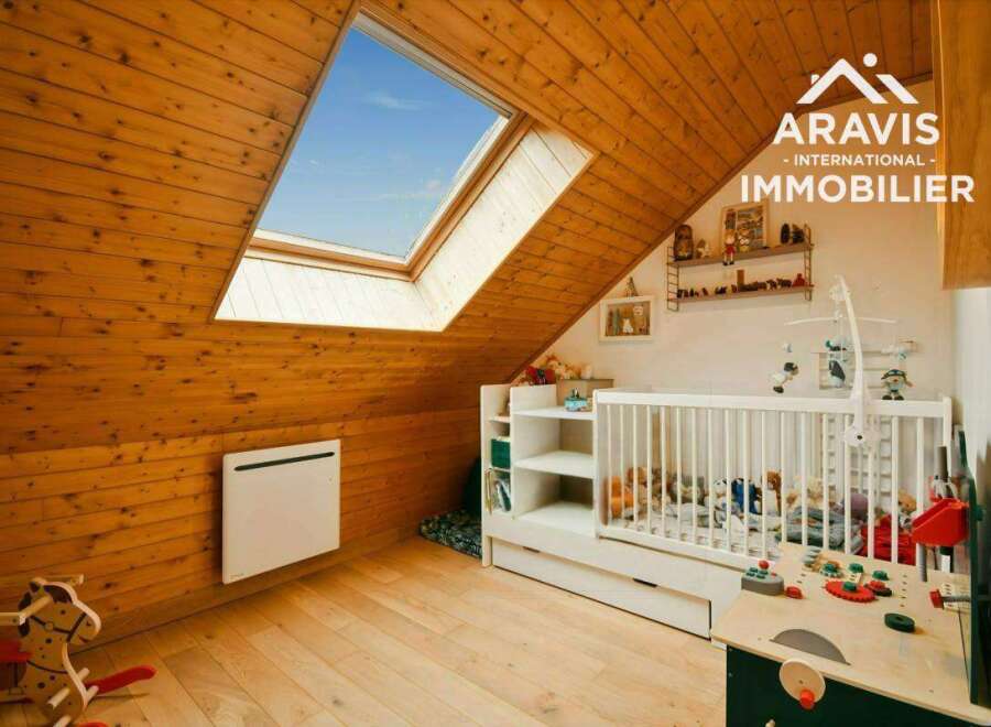 Discover this charming attic room, perfect for a nursery or playroom.