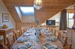 Experience the charm of this stunning property, featuring a beautifully set dining table perfect for hosting gatherings.