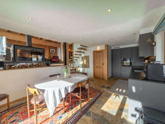 Step into luxury with this stunning property featuring a cozy fireplace, perfect for those chilly evenings.