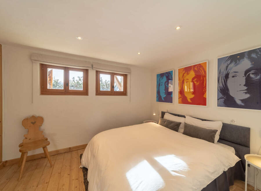This cozy bedroom features a comfortable bed, perfect for a relaxing night's sleep.