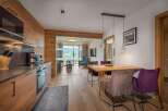 Experience luxury living in this stunning property, featuring a modern kitchen with high-end appliances and sleek design.