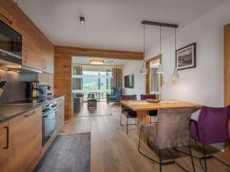 Experience luxury living in this stunning property, featuring a modern kitchen with high-end appliances and sleek design.