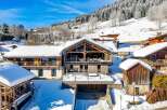 Experience the charm of this stunning chalet nestled in a winter wonderland.