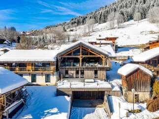 Experience the charm of this stunning chalet nestled in a winter wonderland.