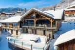 Experience the epitome of luxury living in this stunning chalet nestled in a winter wonderland.