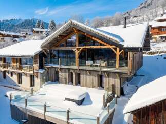 Experience the epitome of luxury living in this stunning chalet nestled in a winter wonderland.