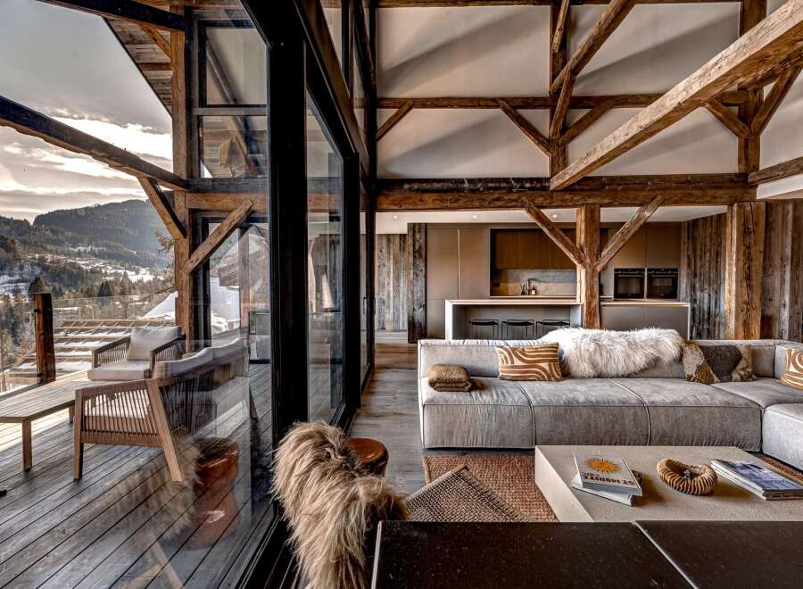 Experience luxury living in this stunning property, featuring expansive windows that frame breathtaking mountain views.