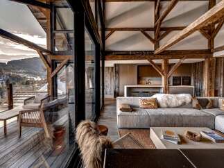 Experience luxury living in this stunning property, featuring expansive windows that frame breathtaking mountain views.