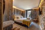 Experience rustic luxury in this stunning bedroom.