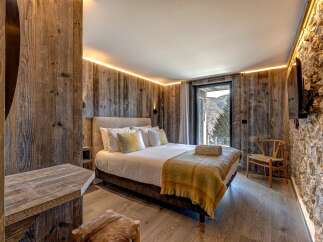 Experience rustic luxury in this stunning bedroom.