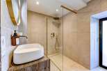 Step into luxury with this stunning bathroom featuring a modern design and high-end finishes.