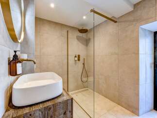 Step into luxury with this stunning bathroom featuring a modern design and high-end finishes.
