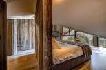 Experience the epitome of rustic luxury in this stunning bedroom.