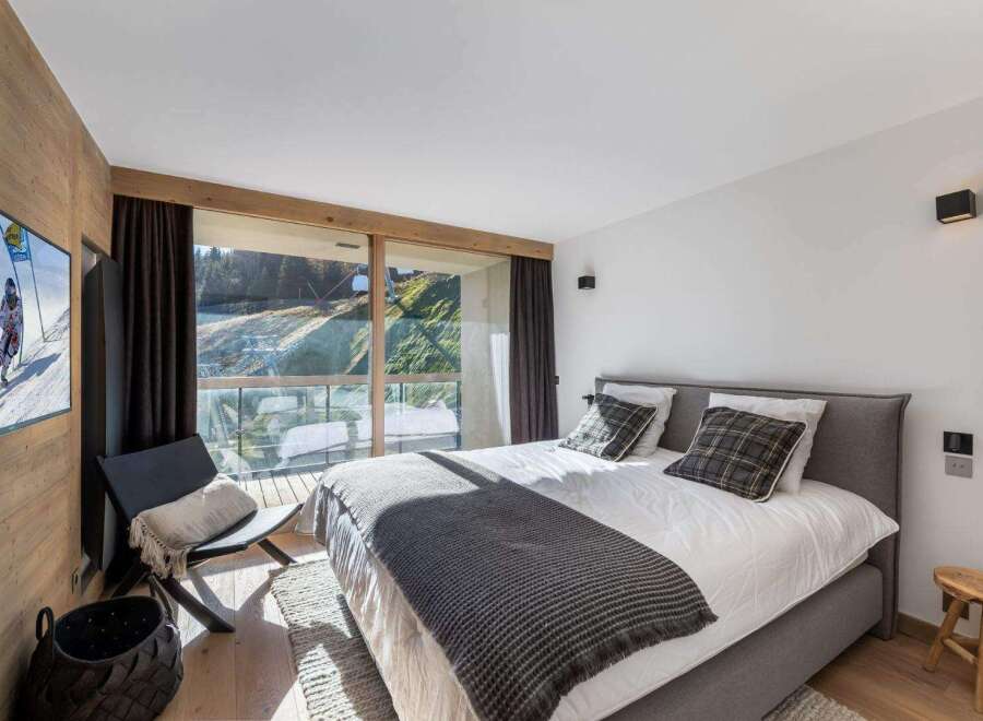 Experience luxury living in this stunning bedroom with breathtaking views.