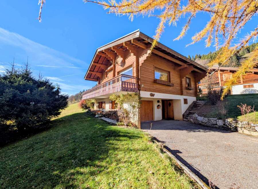 Discover the charm of this stunning wooden chalet nestled in a picturesque setting.