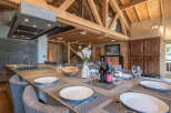 Experience luxury living in this stunning property, featuring a spacious dining area perfect for entertaining.