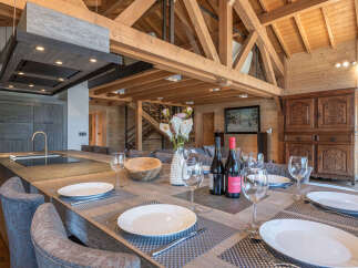 Experience luxury living in this stunning property, featuring a spacious dining area perfect for entertaining.