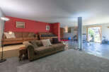 This stunning property boasts a spacious living area, perfect for relaxation and entertainment.