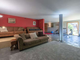 This stunning property boasts a spacious living area, perfect for relaxation and entertainment.
