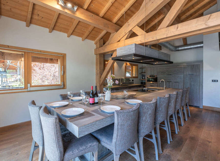 Experience luxury living in this stunning property, featuring a spacious dining area perfect for entertaining.