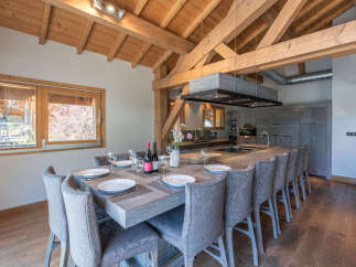 Experience luxury living in this stunning property, featuring a spacious dining area perfect for entertaining.