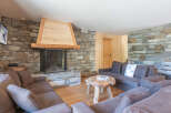 Experience the warmth of this stunning living room, featuring a cozy fireplace and inviting seating.
