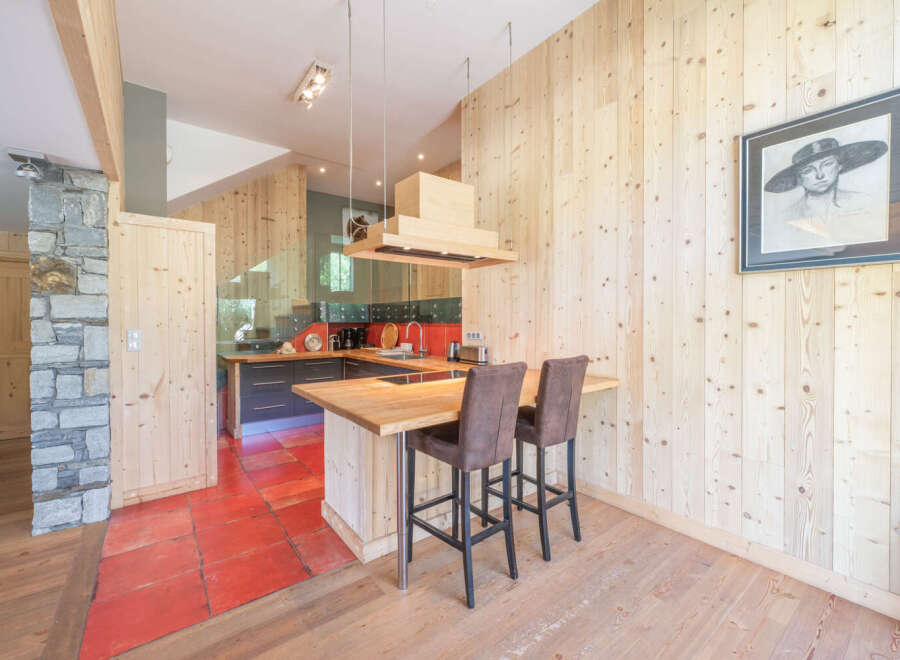 This stunning kitchen boasts a unique blend of rustic charm and modern design.