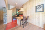 This stunning kitchen boasts a unique blend of rustic charm and modern design.