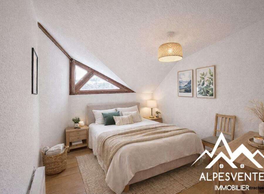 Discover the charm of this cozy bedroom, featuring a unique triangular window that floods the space with natural light.