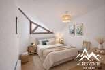 Discover the charm of this cozy bedroom, featuring a unique triangular window that floods the space with natural light.