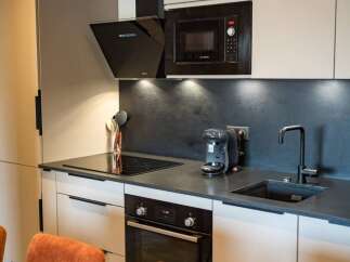 This modern kitchen boasts sleek design and high-end appliances.