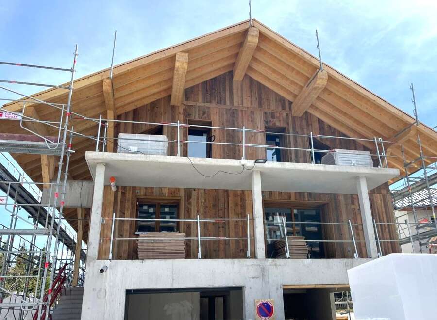 Discover the charm of this stunning new construction home, featuring a beautiful wooden facade and a modern design.