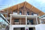 Discover the charm of this stunning new construction home, featuring a beautiful wooden facade and a modern design.