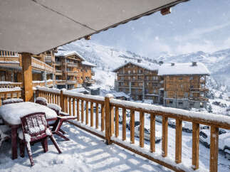Experience the ultimate winter getaway in this stunning ski chalet, offering breathtaking mountain views and a cozy atmosphere.
